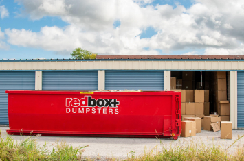 redbox+ dumpster rental in front of storage units