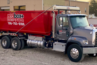 a truck hauling a roll-off dumpster in augusta, ga near me