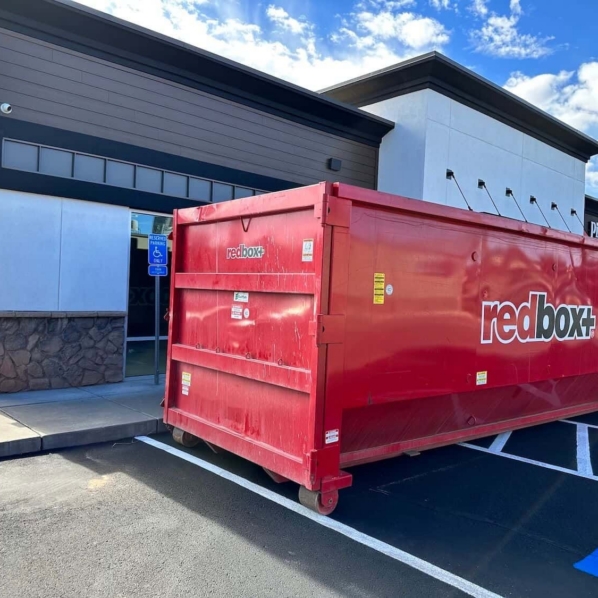 a dumpster outside a commercial construction setting