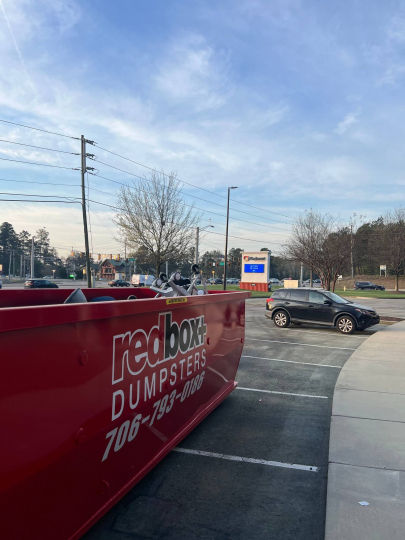 redbox+ dumpster rental in a parking lot in augusta, ga