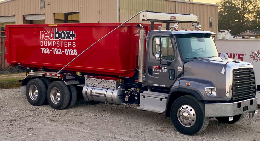 a truck hauling a roll-off dumpster in augusta, ga near me