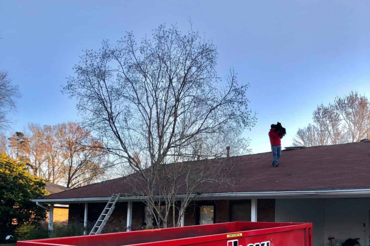 redbox+ Dumpsters of Baton Rouge dumpster in front of residential home