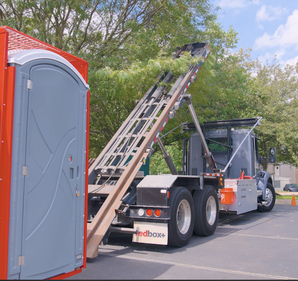 a dumpster being delivered
