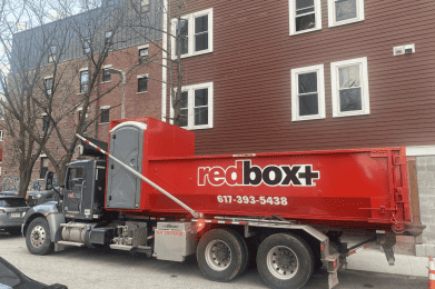 dumpster rental truck in south boston neighborhood