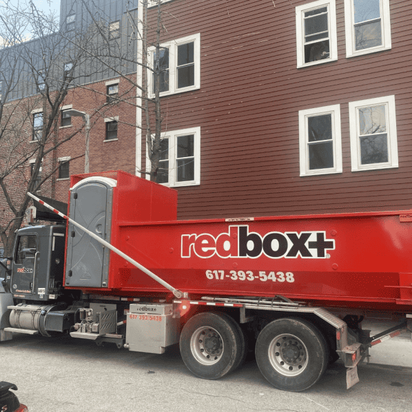 dumpster rental truck in south boston neighborhood