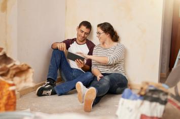 couple sitting in home remodel