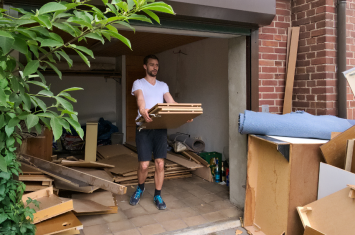 man cleaning out house