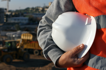 man holding hard hat