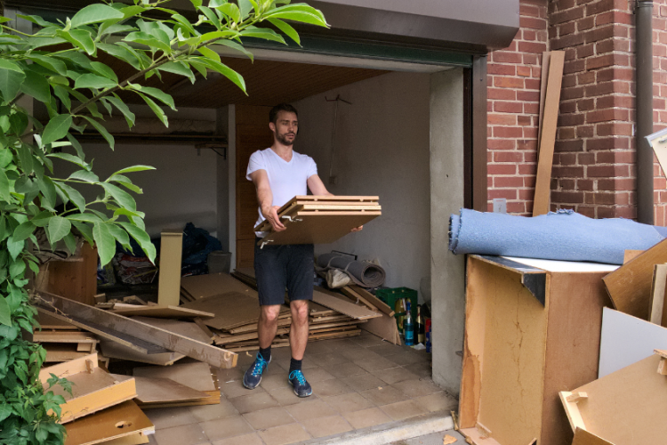 man cleaning out house
