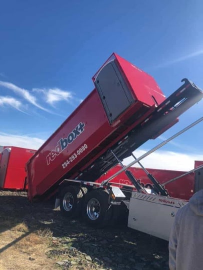 redbox+ dumpsters of central texas dumpster getting dropped off