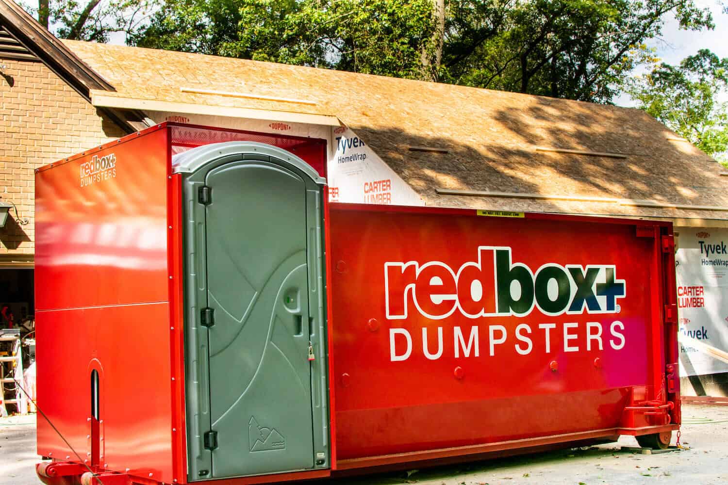 dumpster with a porta potty