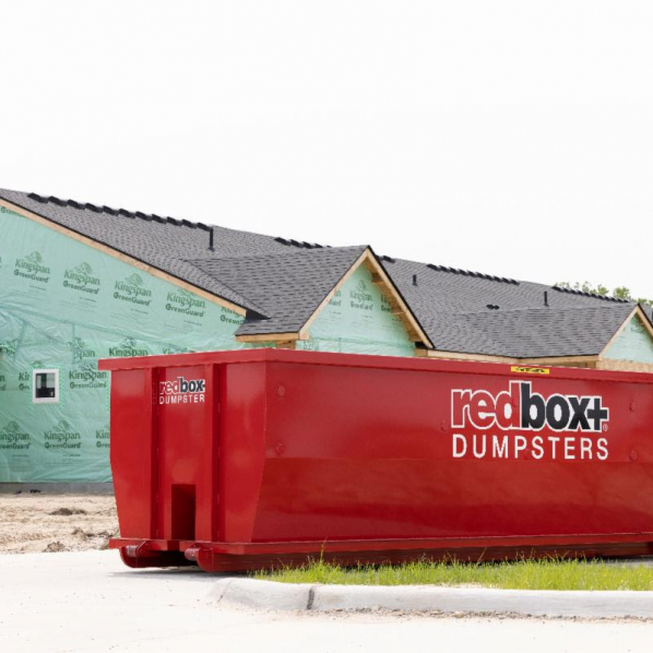 redbox+ Dumpsters of Denver South Metro roll-off dumpster positioned at a new home construction site.