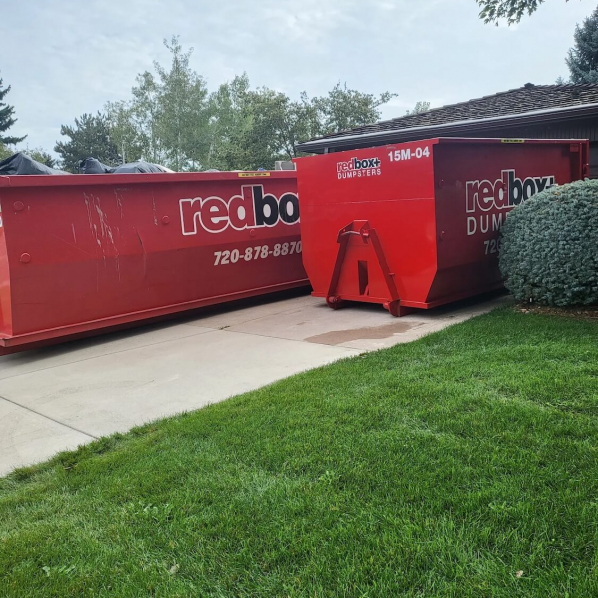 redbox+ Dumpsters of Denver South Metro roll-off dumpsters placed on a residential driveway for a home renovation cleanup.