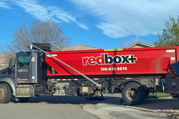 redbox+ Dumpsters of Denver South Metro 30-yard dumpster rental and truck arriving at a residential job site