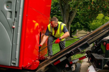 redbox+ Dumpsters of Naples driver of loading dumpster rental