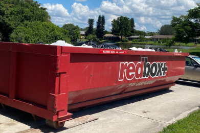 redbox+ dumpster in front of house full