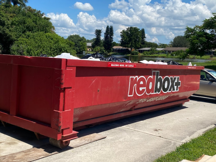 redbox+ dumpster in front of house full