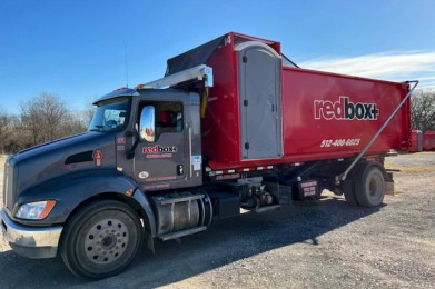 truck delivering elite dumpster rental in austin tx