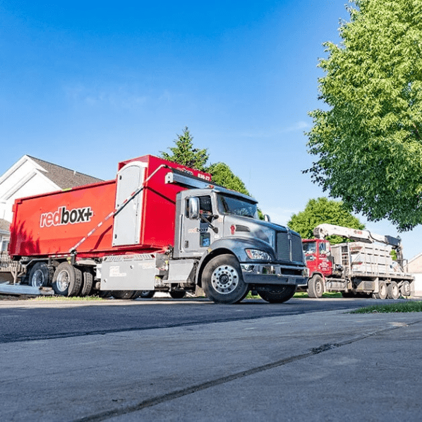 truck delivering elite dumpster rental in austin, tx