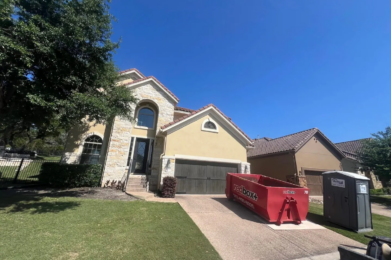 redbox+ dumpster placed in a residential driveway