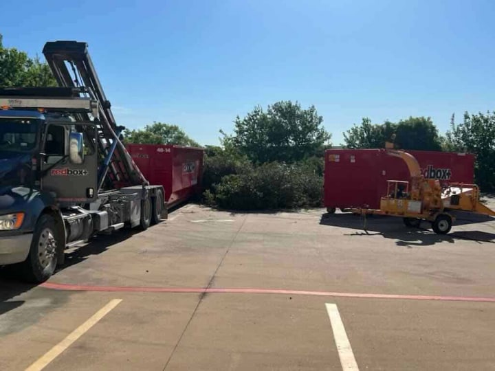 landscaping project loading into dumpster rental in austin
