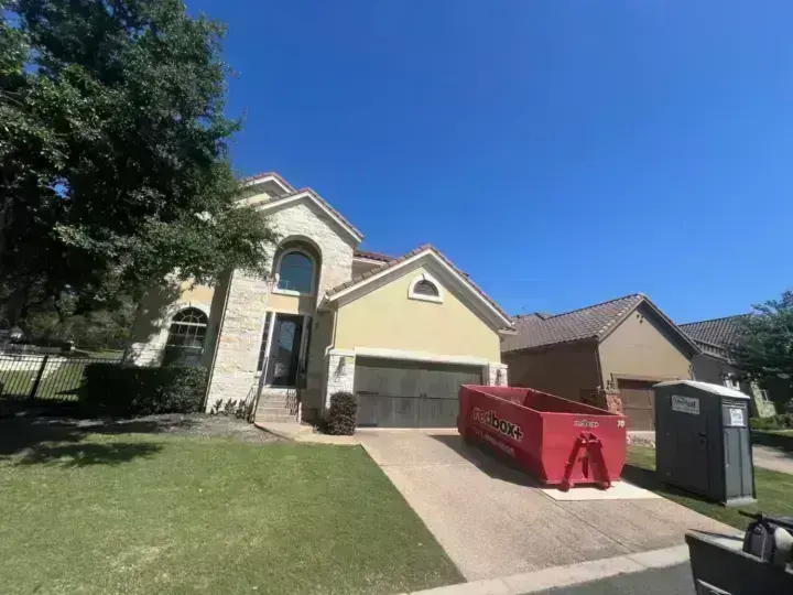 redbox+ dumpster placed in a residential driveway