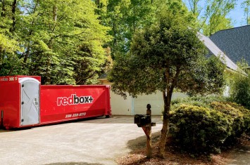 a dumpster in a backyard