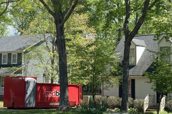 a dumpster outside of a home
