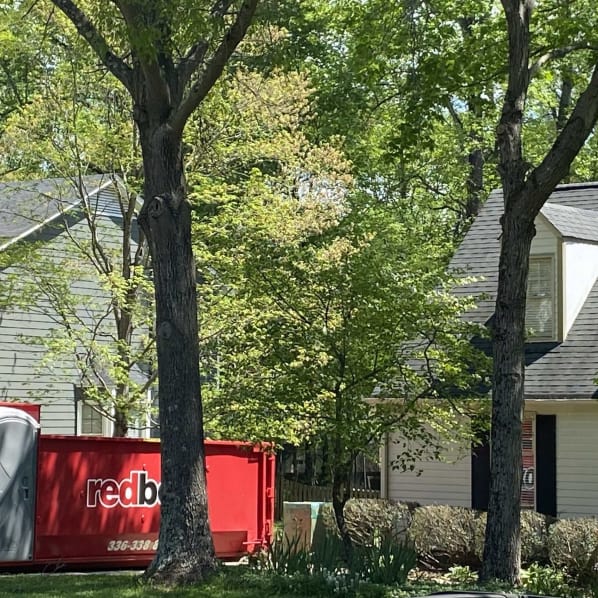 a dumpster outside of a home