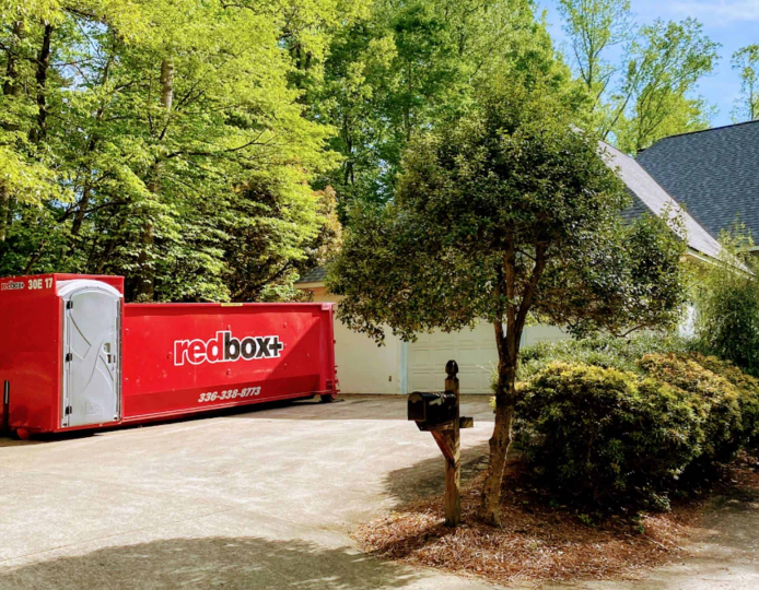 a dumpster in a backyard