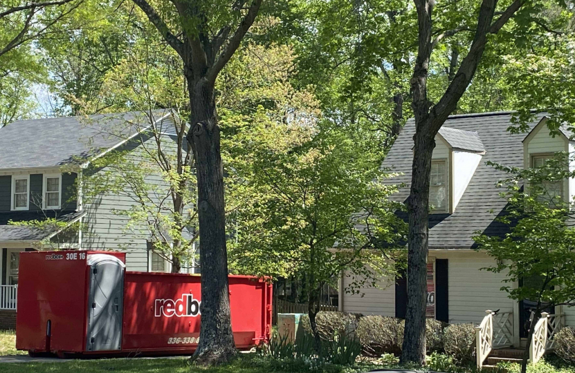 a dumpster outside of a home
