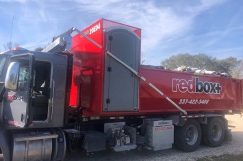 redbox+ Dumpsters of Lafayette dumpster with porta potty at commercial site