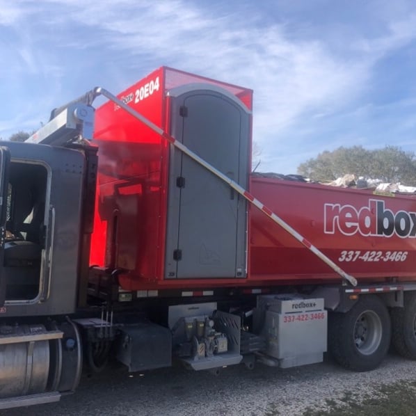 redbox+ Dumpsters of Lafayette dumpster with porta potty at commercial site