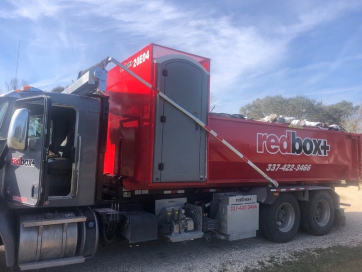 redbox+ Dumpsters of Lafayette dumpster with porta potty at commercial site