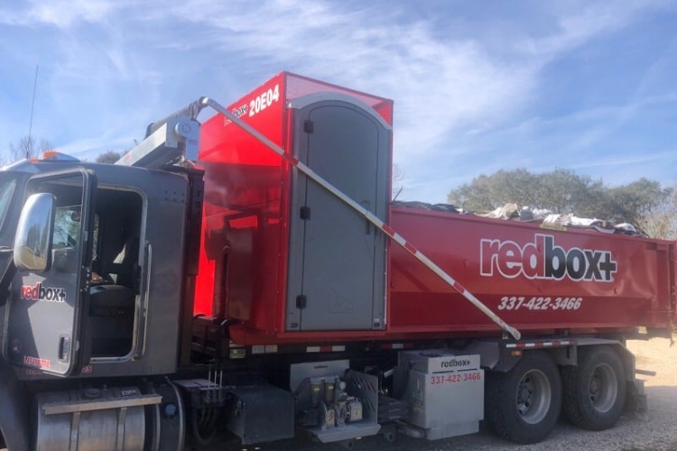 redbox+ Dumpsters of Lafayette dumpster with porta potty at commercial site