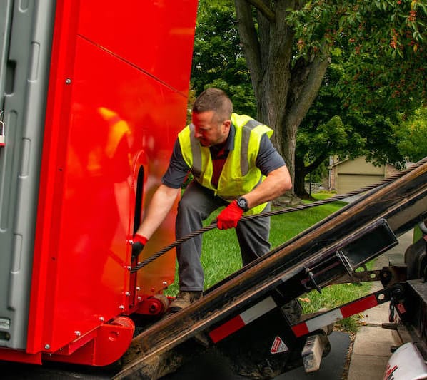 redbox+ Dumpsters of Naples driver of loading dumpster rental