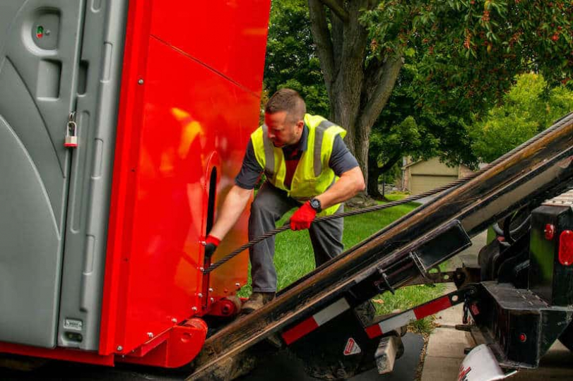 redbox+ Dumpsters of Naples driver of loading dumpster rental