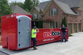 redbox+ Dumpsters of Northeast Atlanta team by a 20-yard Elite dumpster rental