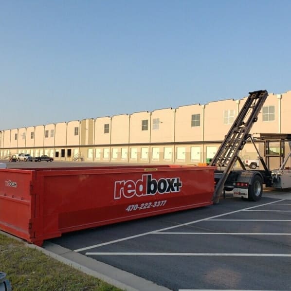 redbox+ Dumpsters of Northeast Atlanta roll-off dumpster arriving at a job near Lawrenceville, GA