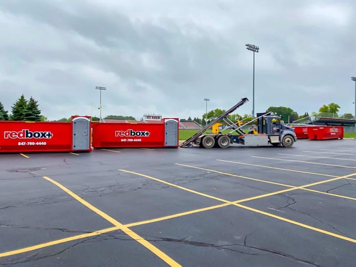 elite dumpsters in parking lot