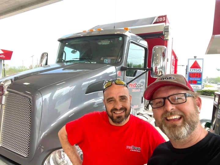 redbox+ dumpsters owners next to truck