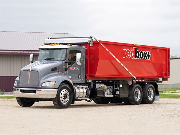 redbox+ dumpster rental on delivery truck
