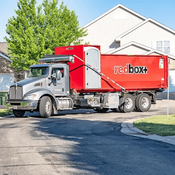 redbox+ dumpster being delivered to a residential home