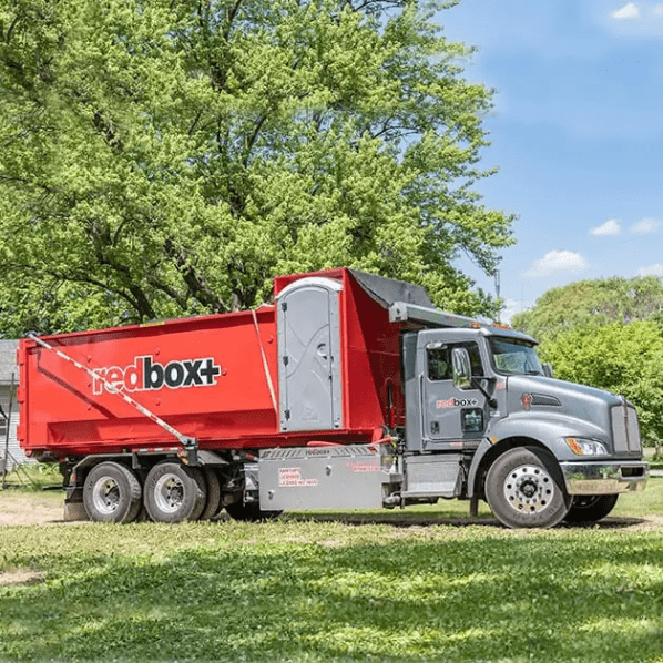 redbox+ dumpster rental with porta potty on delivery truck