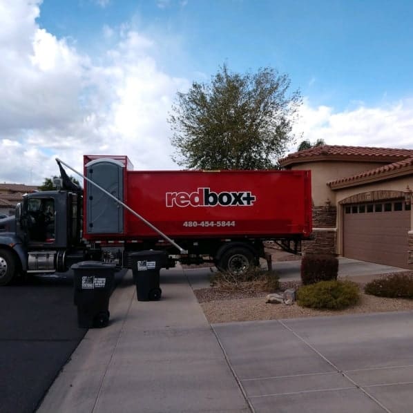 dumpster rental truck in driveway phoenix and scottsdale