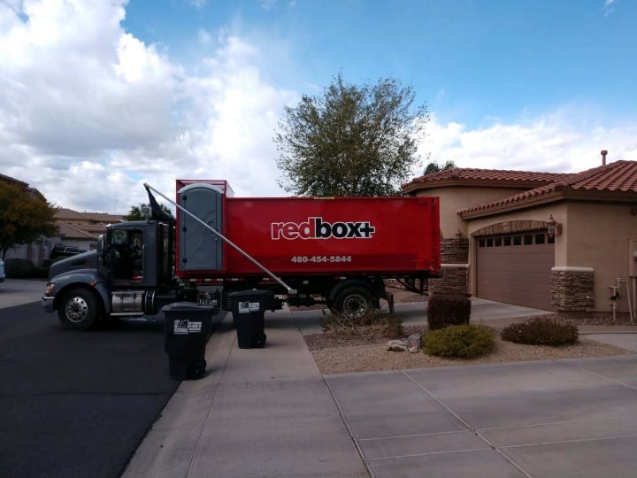 dumpster rental truck in driveway phoenix and scottsdale