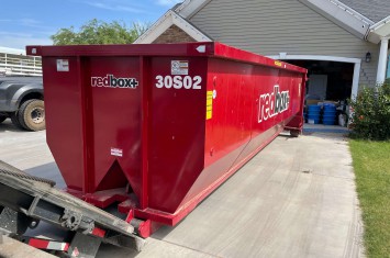 red traditional roll-off dumpster rental