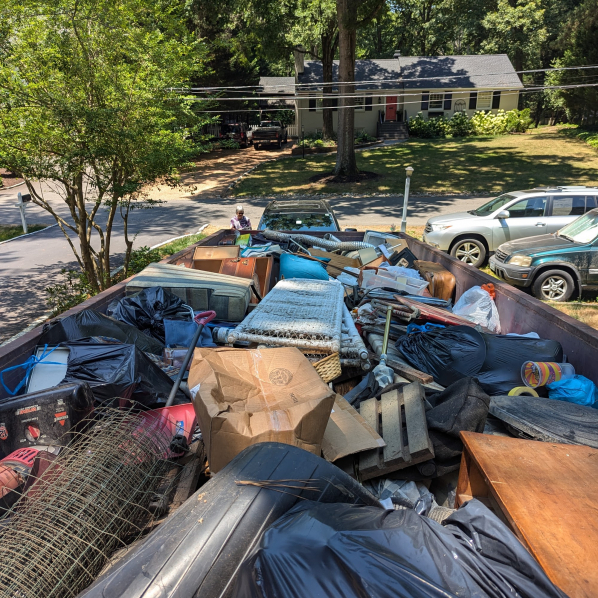 a dumpster rental stuffed to brim