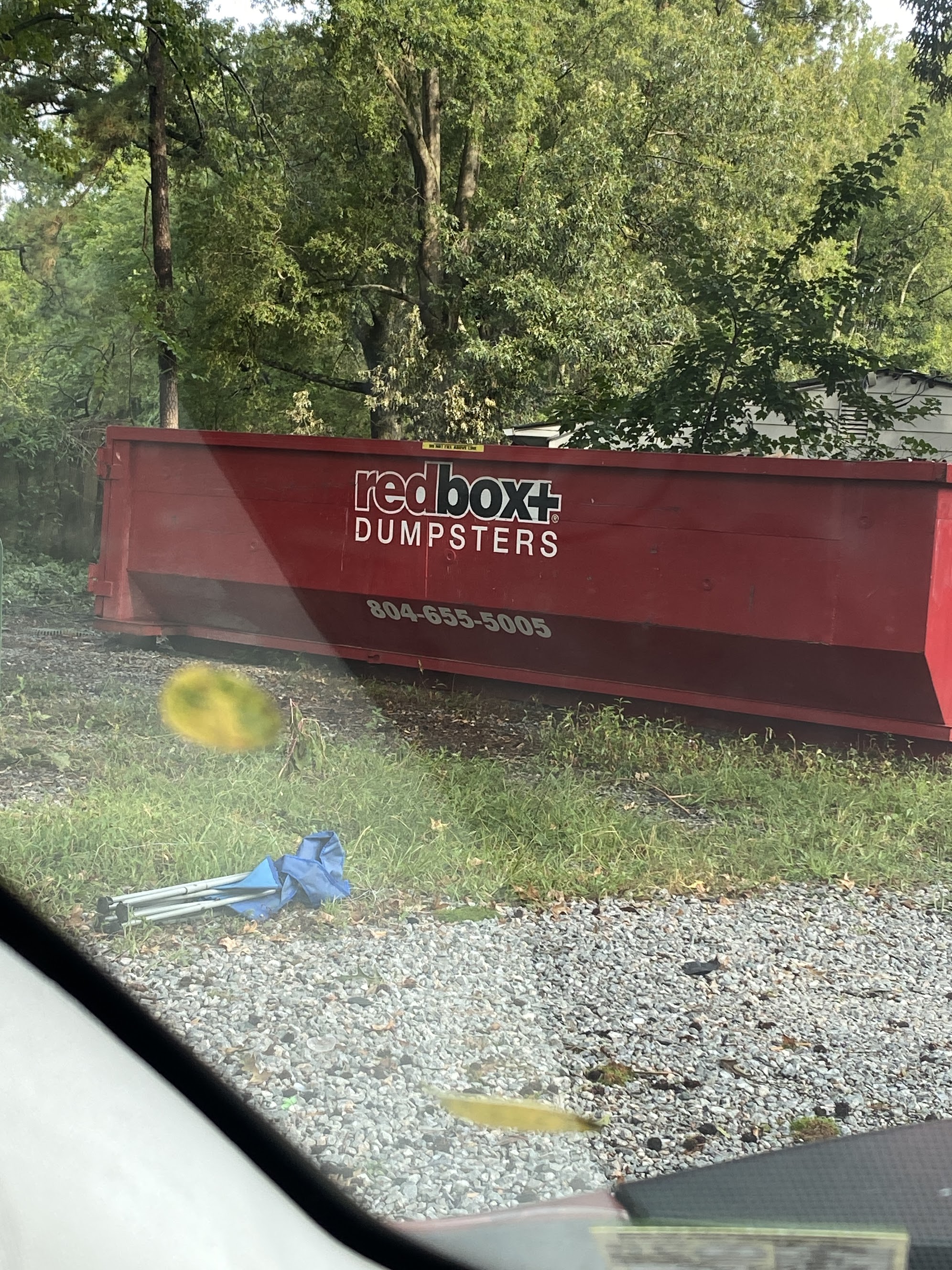 yard waste dumpster arriving on site to Richmond