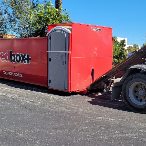 redbox+ dumpster in front of business